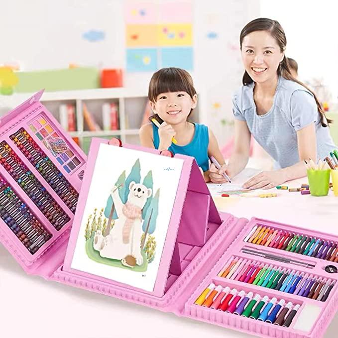 Child painting with easel at kitchen table